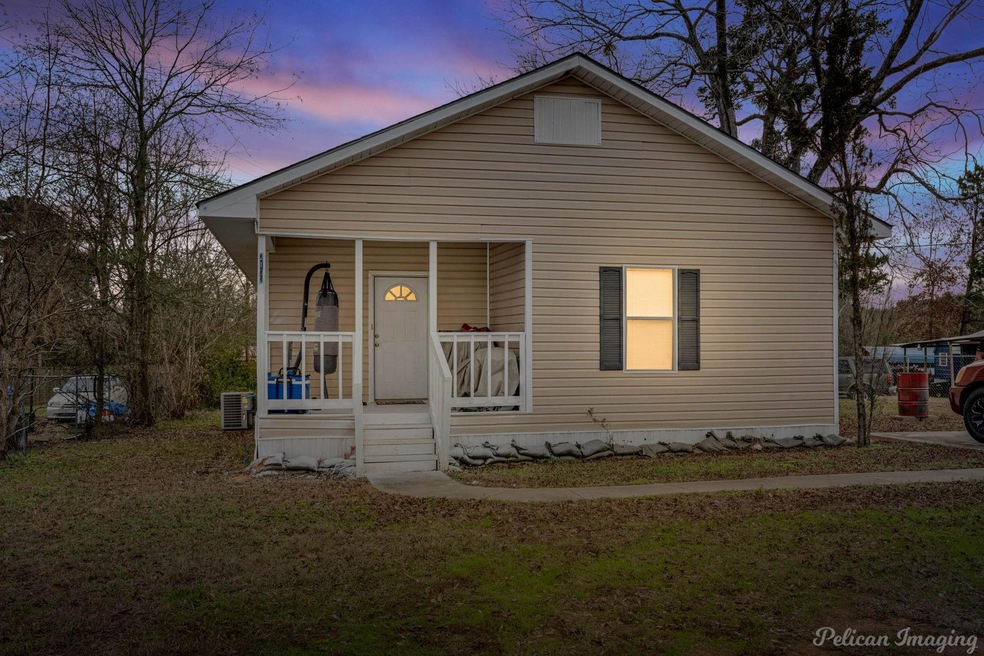 Bungalow-style house with a porch, central AC unit