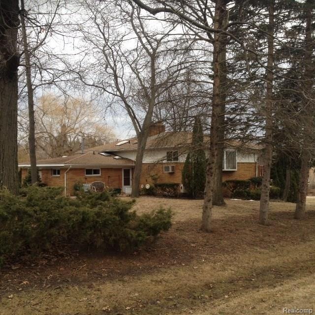 CORNER OF HOUSE AS VIEWED FROM ROAD