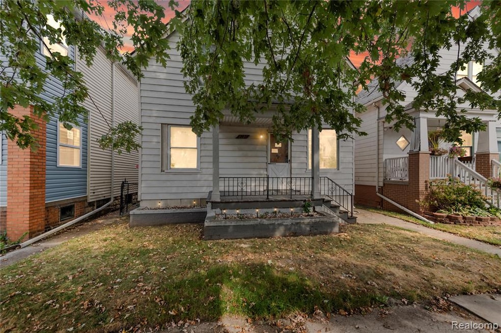 View of front of house featuring a front yard and a vegetable garden