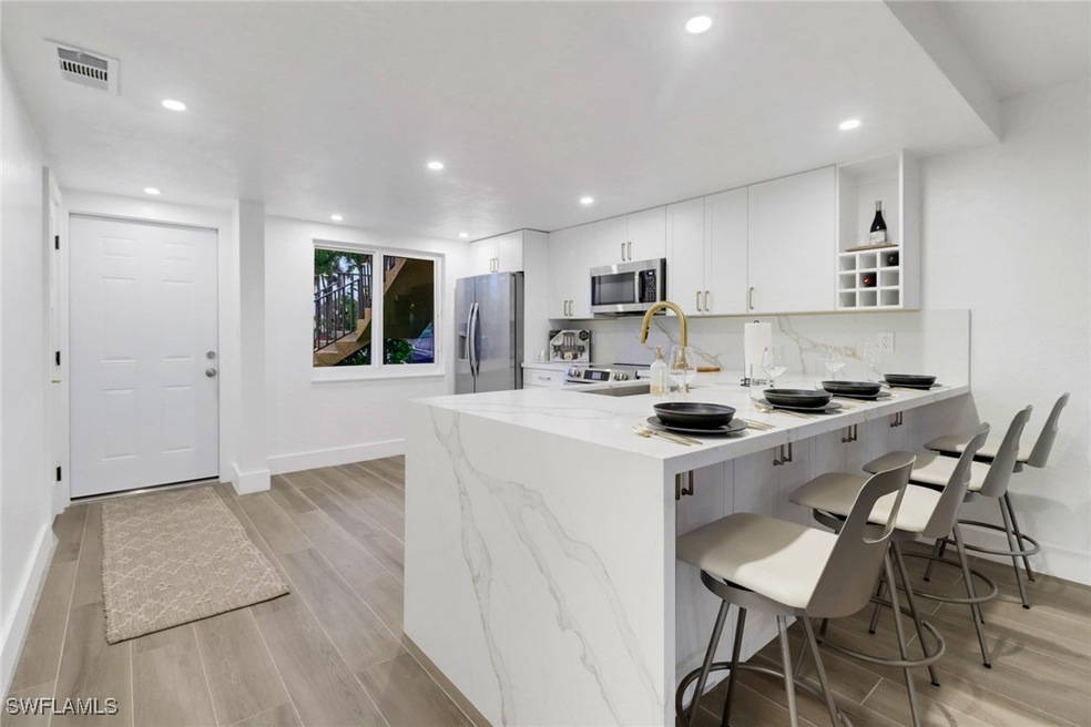 Kitchen featuring appliances with brass and stainl