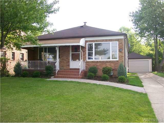 Exterior Front. New vinyl siding, brick front, cov