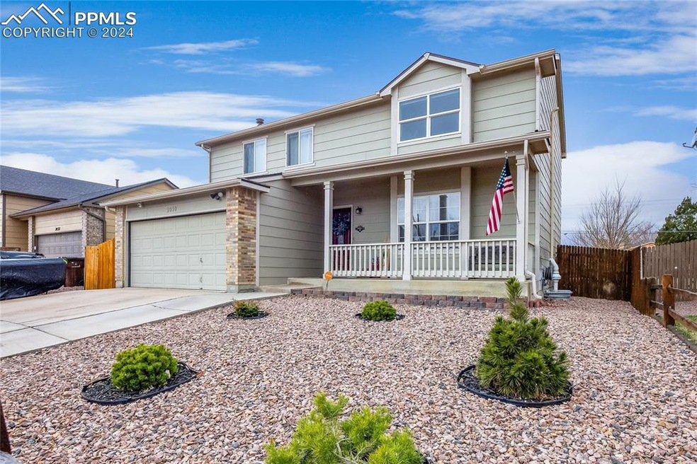 View of front elevation with covered porch and xer