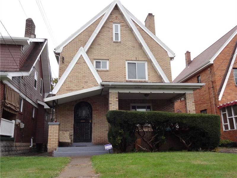 Brick house on a quiet tree lined street