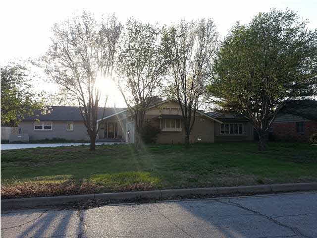 Beautiful curb appeal with mature trees