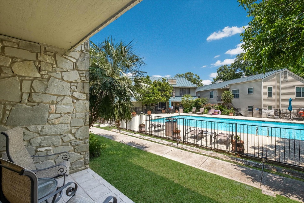 Community pool featuring a patio