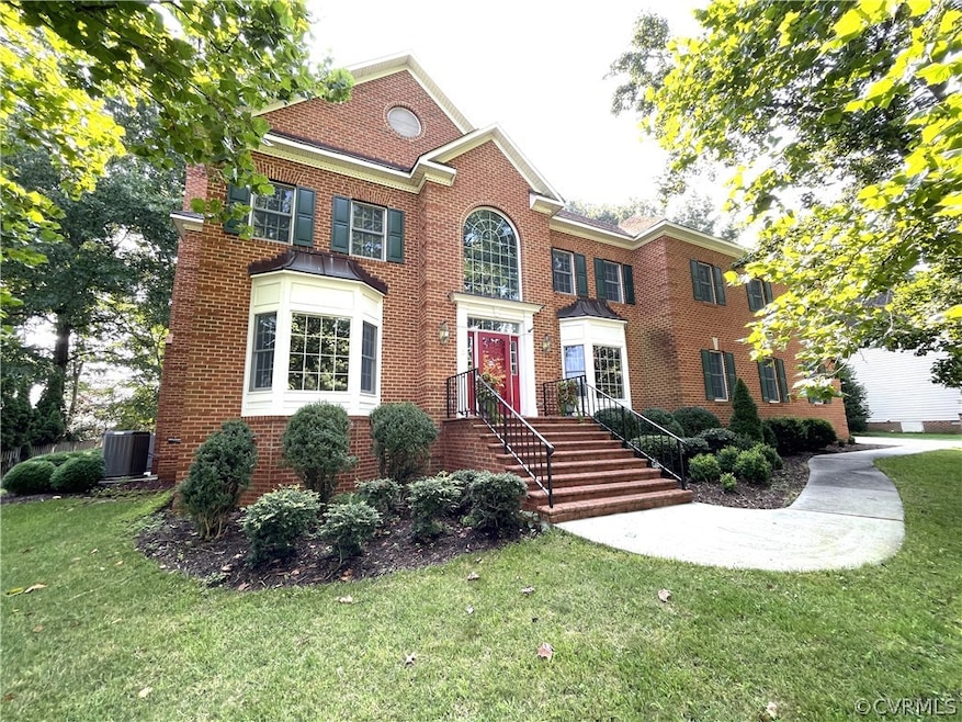 Colonial inspired home featuring a front yard