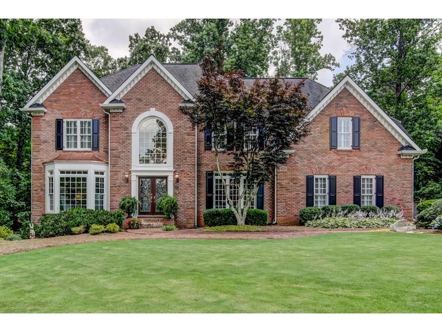 Beautiful 3 sided brick executive home in popular 