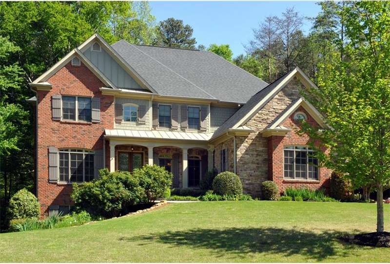 Custom built 3 sided brick and stone traditional w