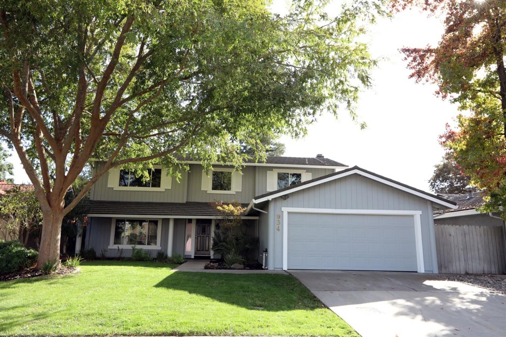 Beautiful 2-story home with lush green yard, fresh