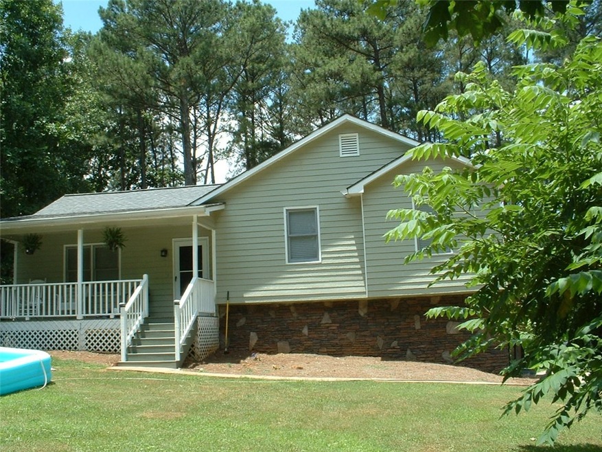Front view of home with rock accents, new roof and