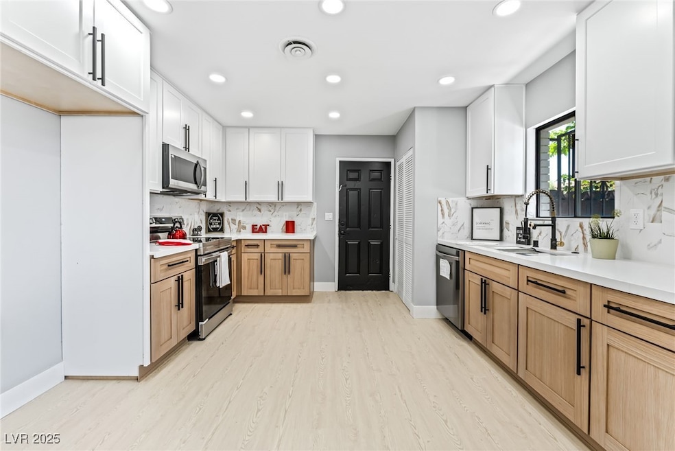Kitchen featuring appliances with stainless steel
