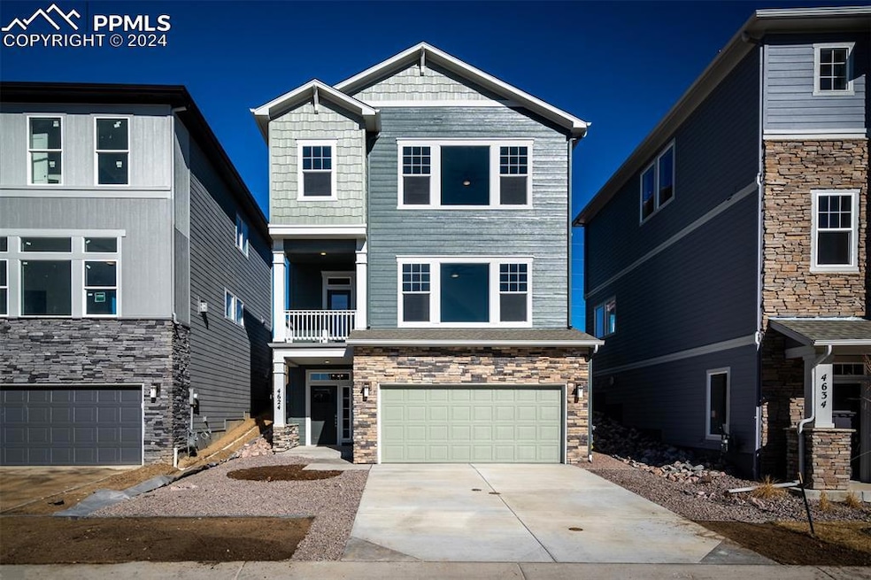 View of front facade featuring a garage