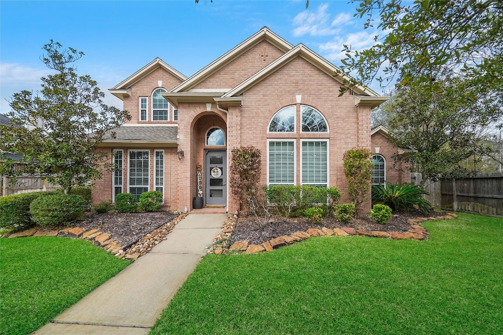 14902 Windmill Cove Ln sits on a quiet cul de sac lot.