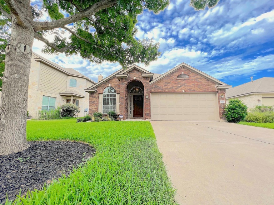 Traditional-style house featuring brick siding, a