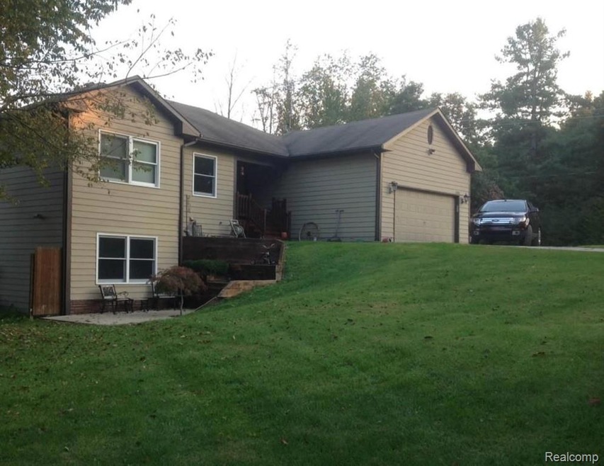 Front view of home showing lower level patio