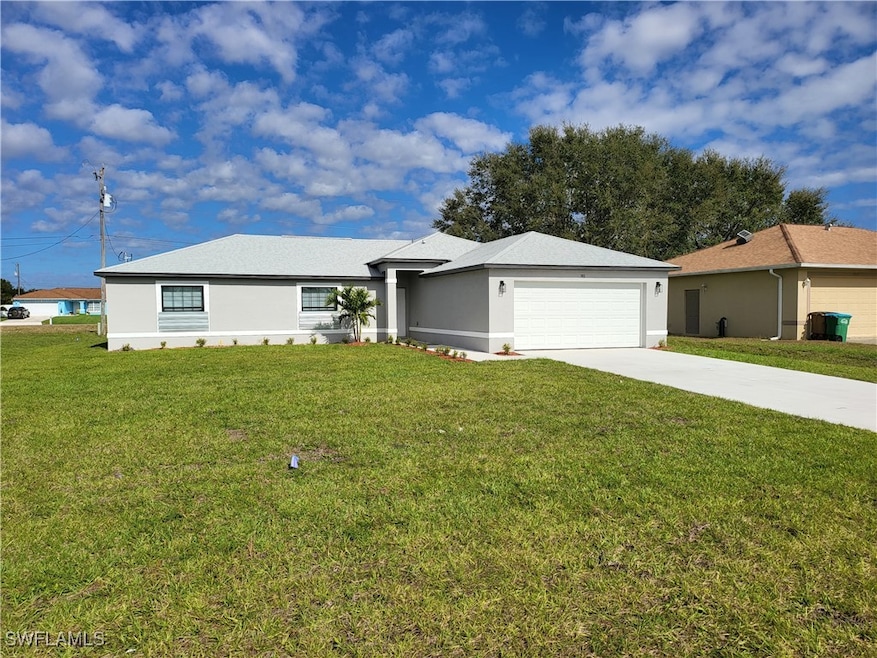 Ranch-style home with stucco siding, concrete driv
