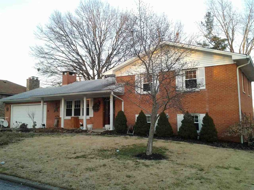 Brick tri-level with mature landscaping