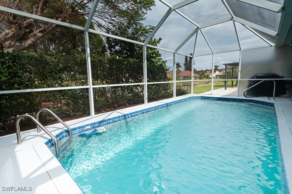 View of swimming pool with area for grilling and g