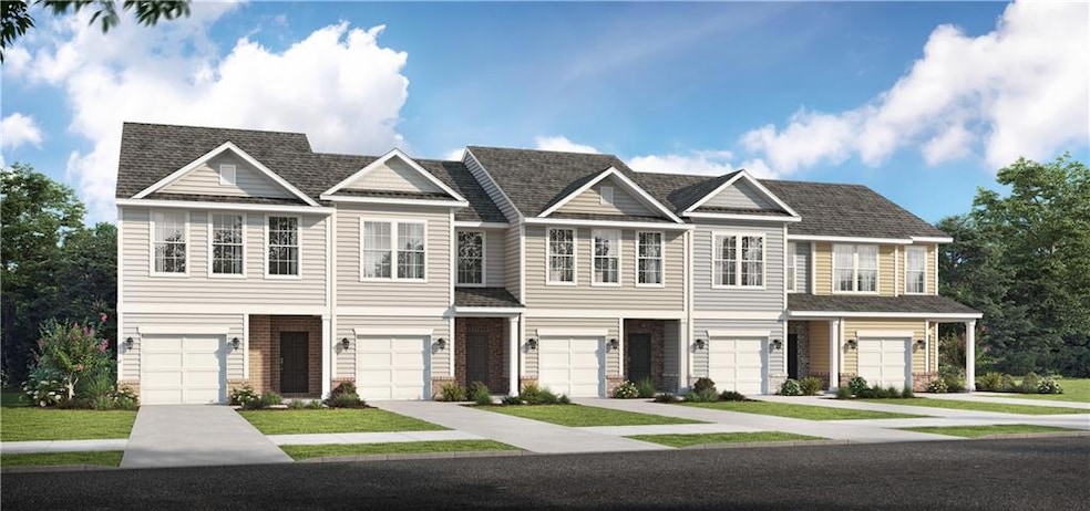 Townhome / multi-family property with a garage