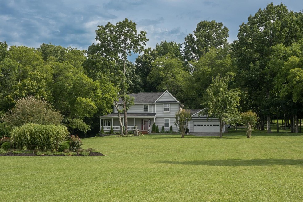 Beautiful farm house with amazing covered front porch with swing!