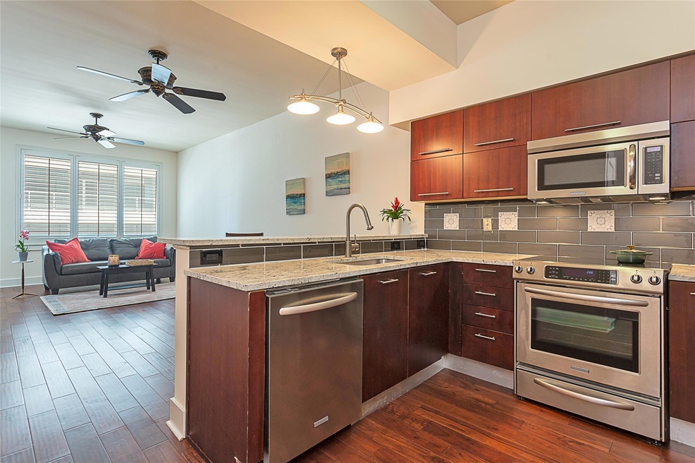 Kitchen with stainless steel appliances, a penins
