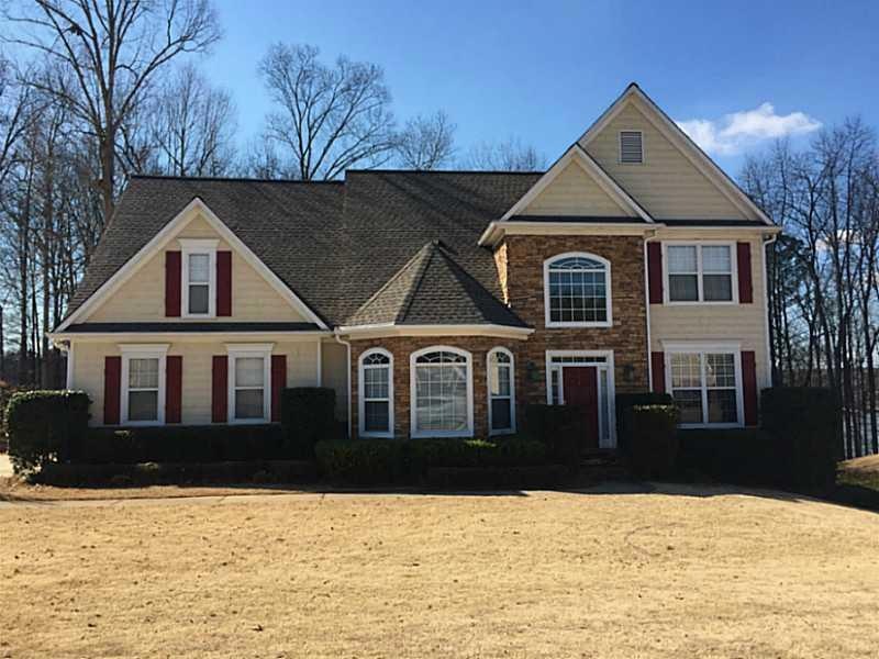 Exterior Front. Lakefront Home on Premium Lake Lot