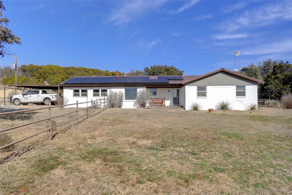 View of front of home with solar panels and a fron
