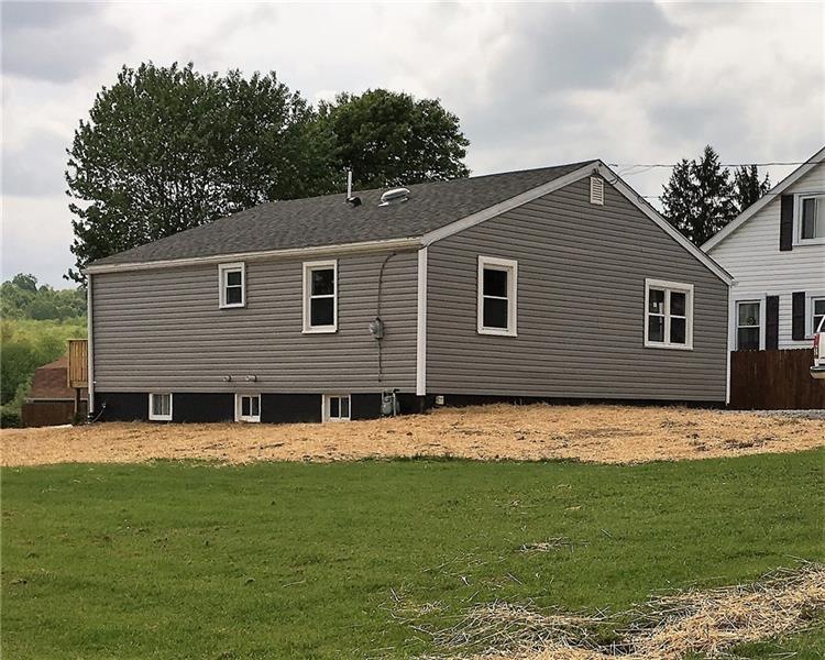 New siding, new roof, new yard.  Some of the yard 