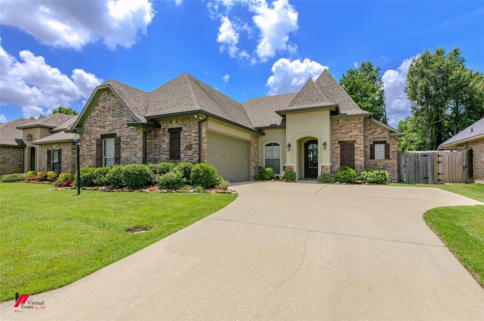 French country style house featuring a garage and 