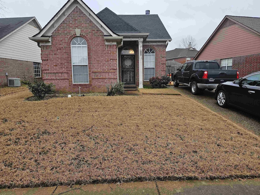 View of front property with central AC unit and a 