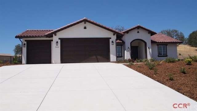 Front of the home - features a 3 car garage, finis