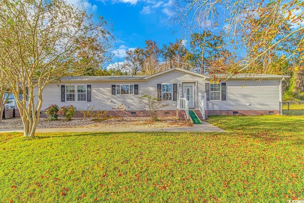 Single story home with a front yard