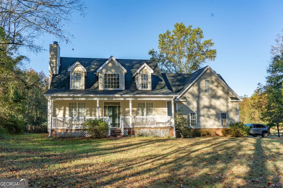 View of the front of the home with a rocking chair