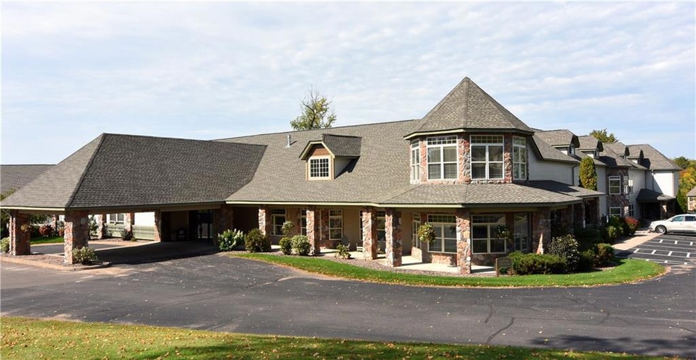 Front view of the condo with covered front entranc