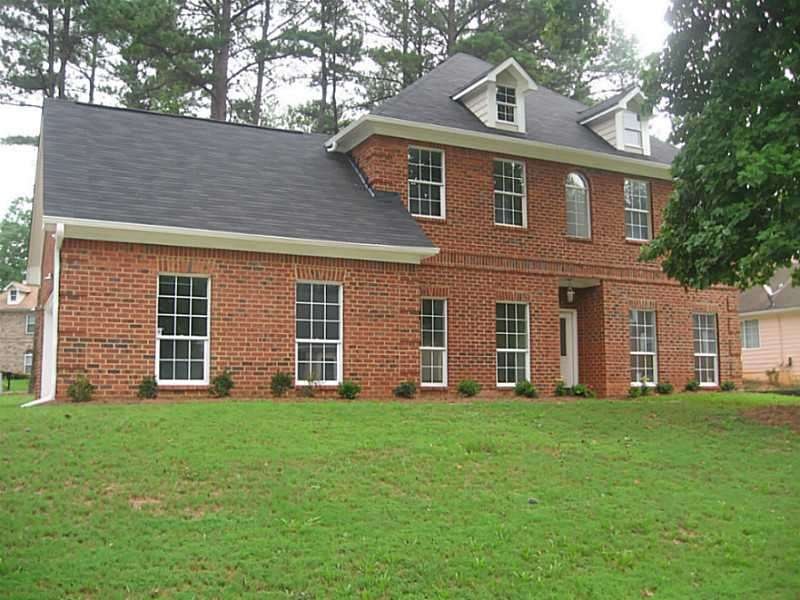 Exterior Front. 3-sided Brick home.