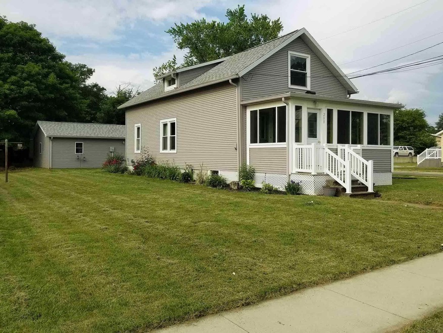 Front of home and side yard.