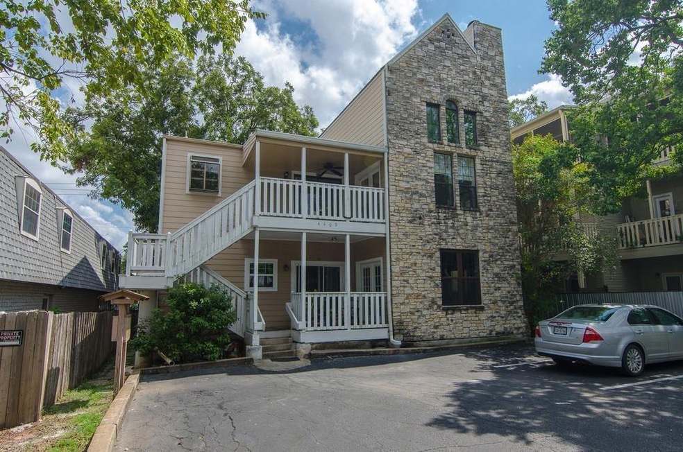 View of front of property with a ceiling fan, sto