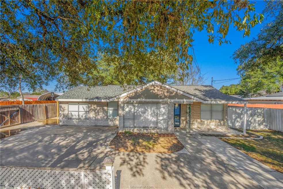 Ranch-style home with concrete driveway, a garage,