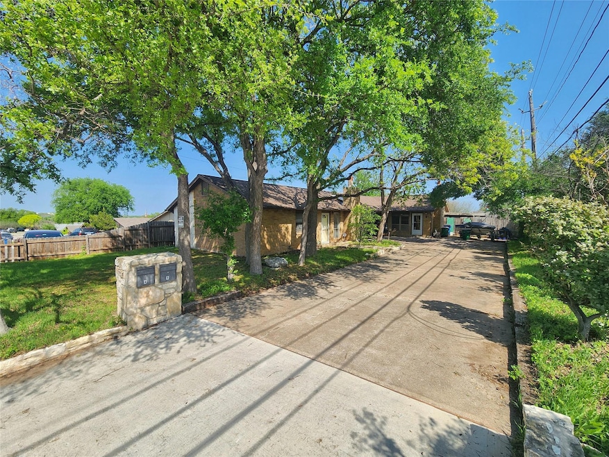 View of front facade featuring concrete driveway,