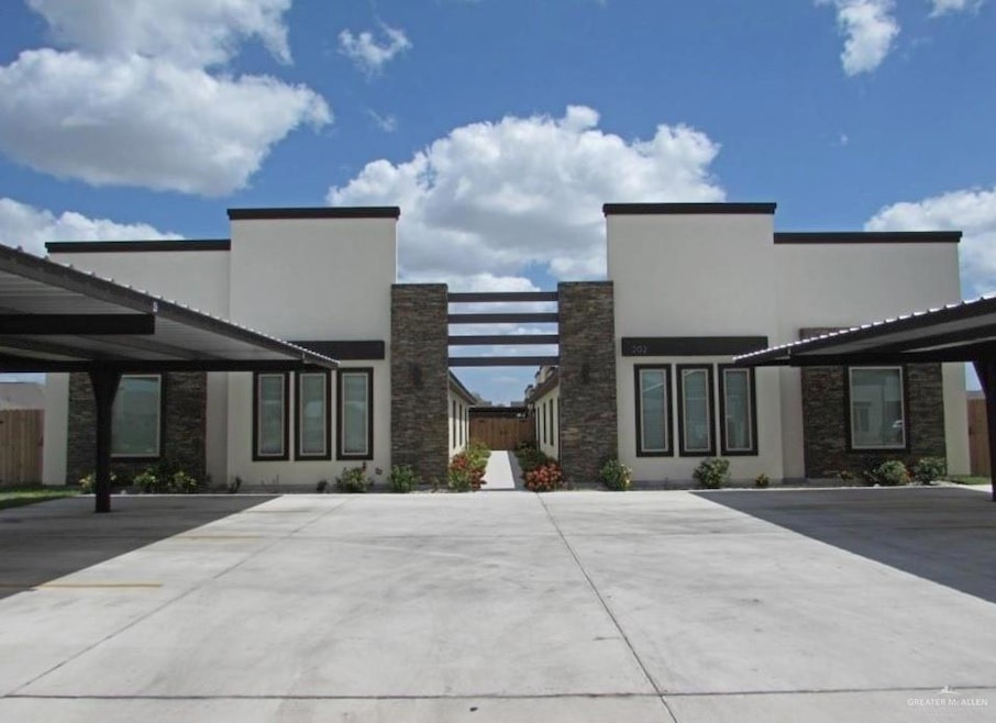 View of front of property with stone siding and stucco siding