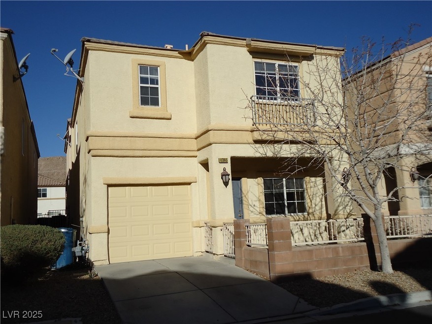 View of front facade featuring a garage, a porch,