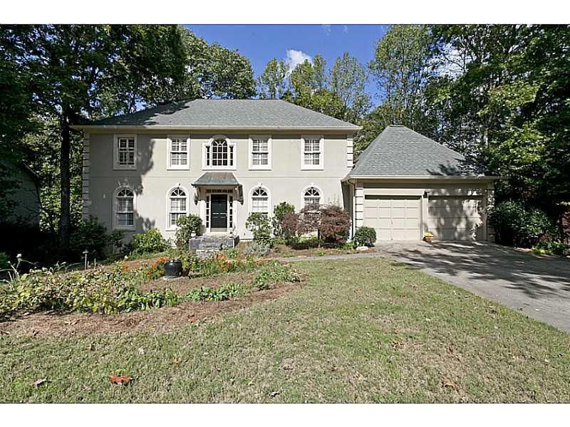 Exterior Front. Beautiful front yard w/ wild flowe