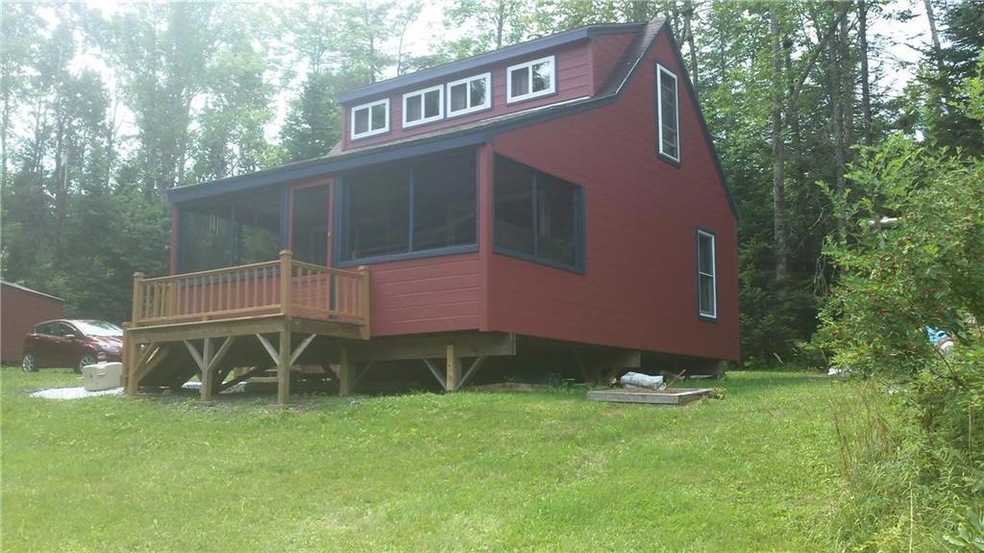 Front view with a large new dormer.
