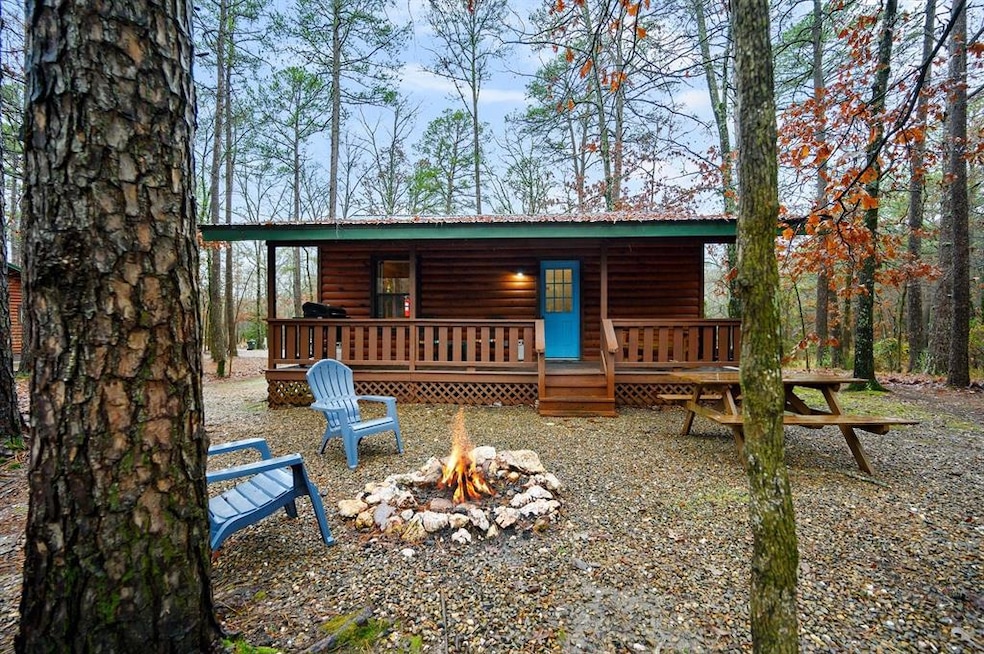 Rear view of property with a wooden deck and an ou