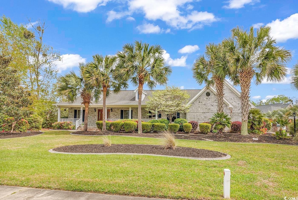 Ranch-style home featuring a front lawn, brick sid
