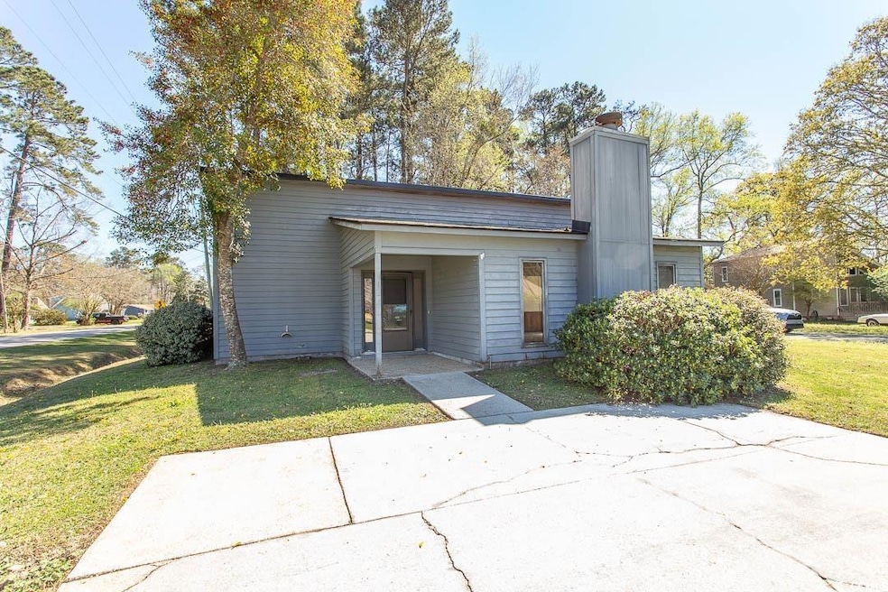Mid-century inspired home with a chimney and a fro