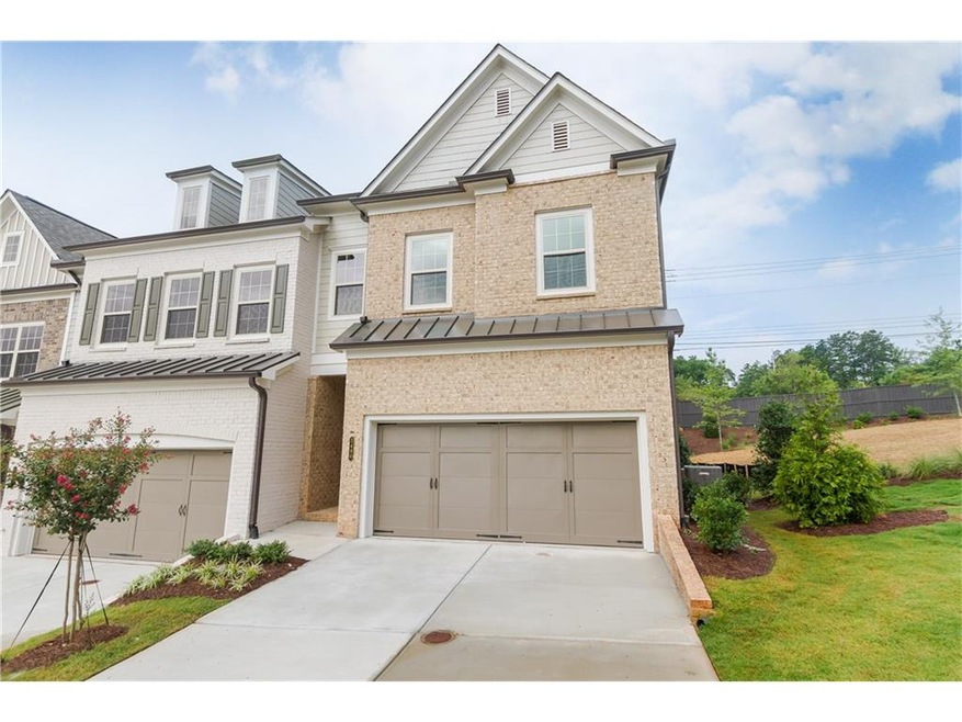 Homesite 6 is a sunny END unit with brick elevatio