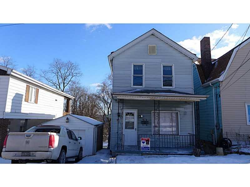 Exterior Front. Covered front porch, detached gara