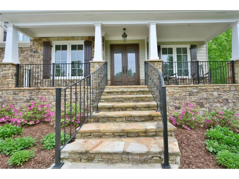 Intricate wrought iron railing and stone stairway 
