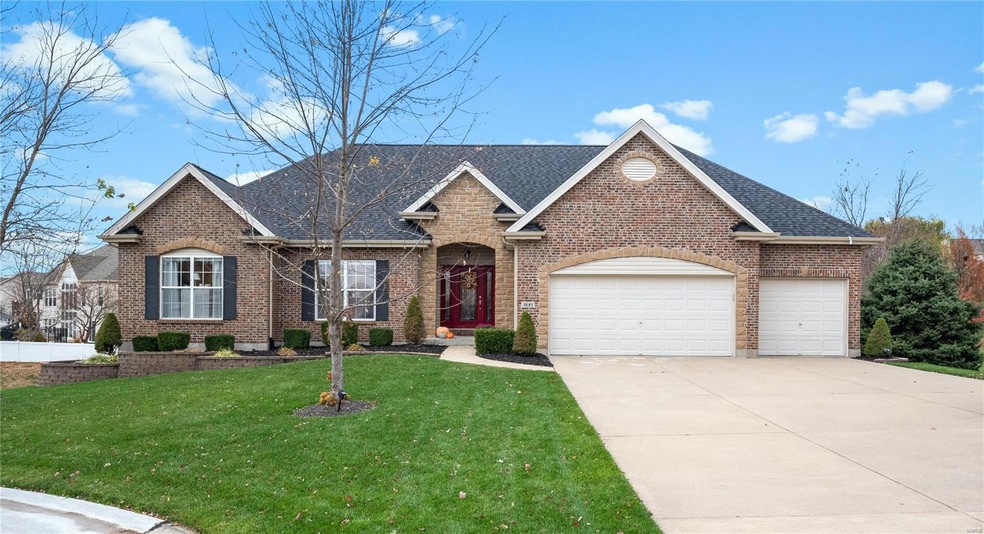 Welcome home to 1621 Brett Ridge! The brick and st